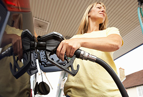 Lady Taking Oil In Car